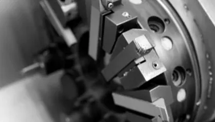 3D printer building a part, black and white