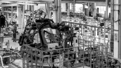 Automated welding cell on a factory floor