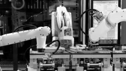 Collaborative robots working in an automated cell