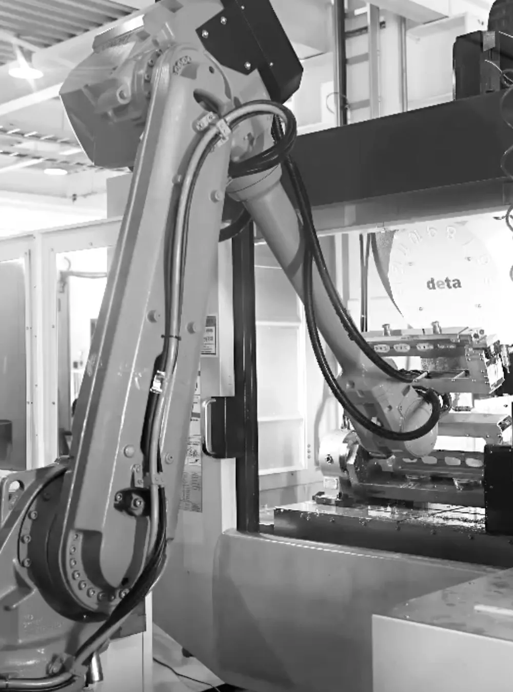 Robot arm handling an INNGRIT quick-exchange module